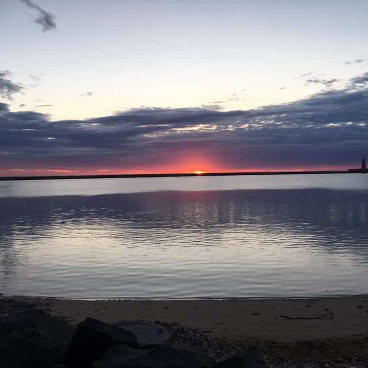 The gourgeous sunrise and backdrop of the swim and the run